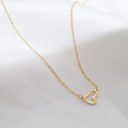 Dainty Heart Necklace for Women — 18K Gold Plated, Minimalist Gold Heart Pendant on model
